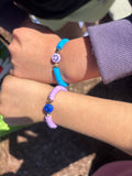 2 bracelets purple and blue