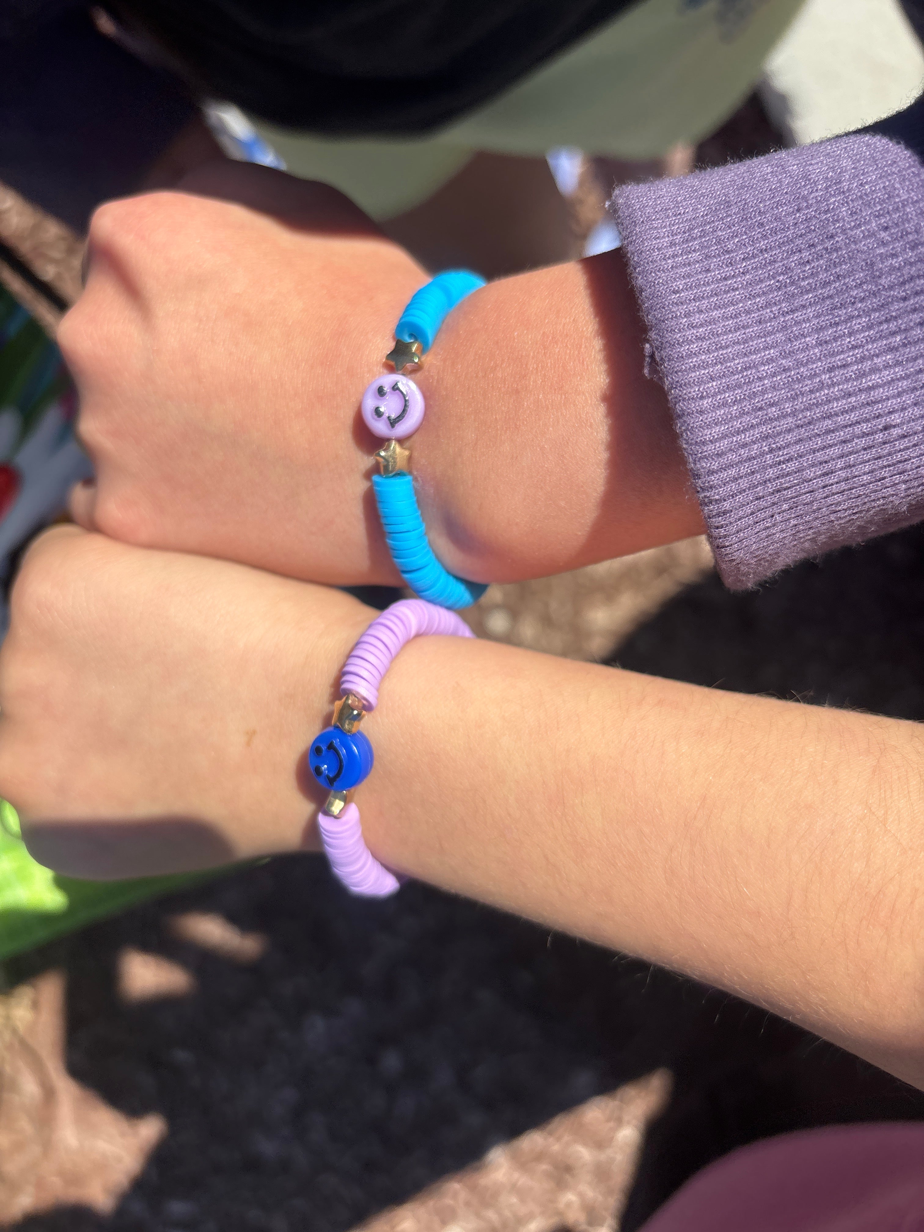 2 bracelets purple and blue